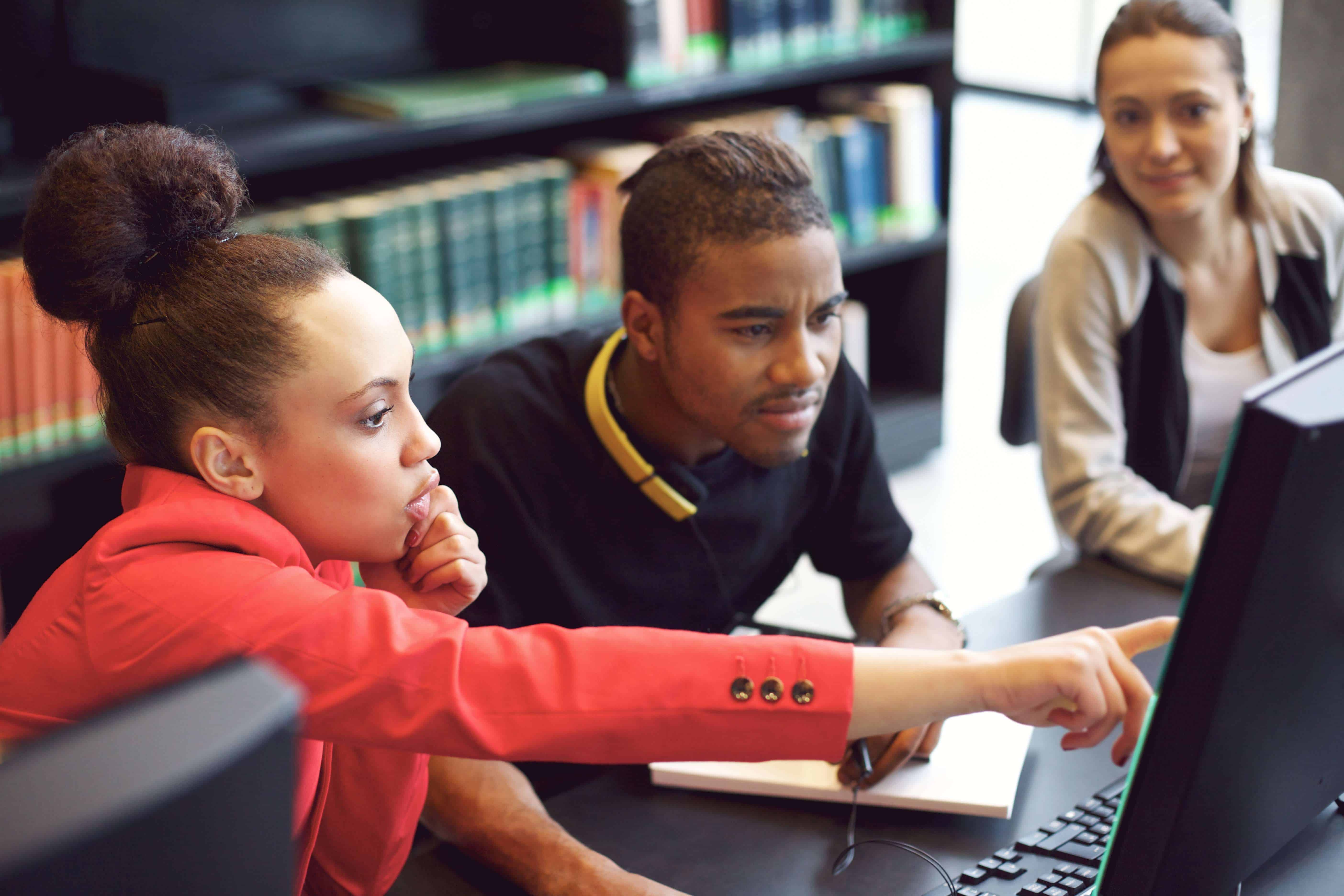 Students working on desktop computer