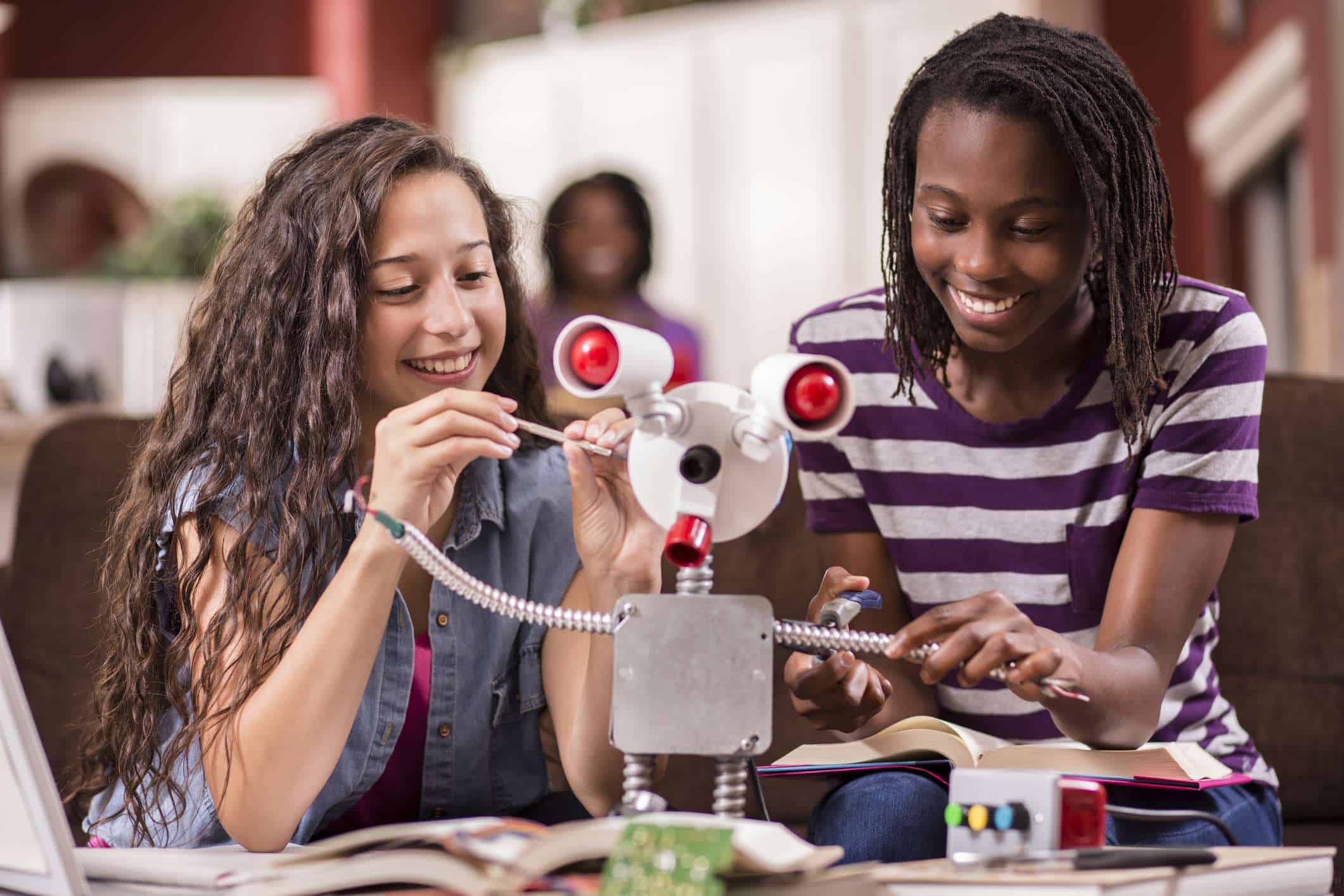 Girls learning about engineering, science, robotics, STEM, and STEAM